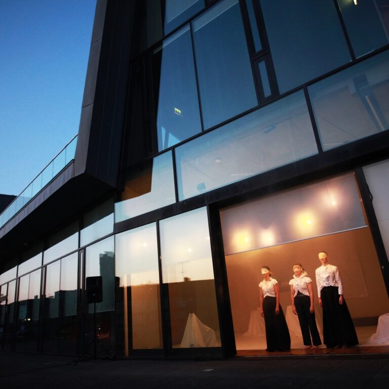 Photo of three masked women in a doorway of Source Arts Centre